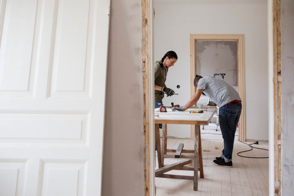 Couple working at workbench during renovation