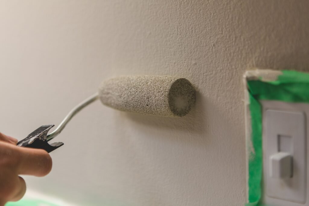 rolling-a-paintbrush-in-white-gray-paint-next-to-a-2026-03-16-23-48-44-utc